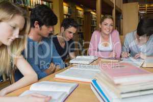 Students in the library studying together