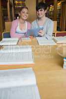 Students with tablet pc at study table
