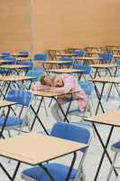 Student napping in exam hall