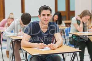 Man looking up from exam and smiling