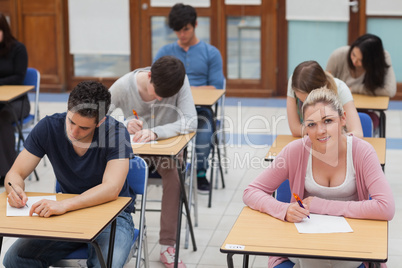 Students sitting at the exam room concentrating