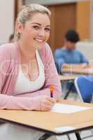 Girl sitting at desk smiling