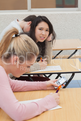 Woman sitting at the desk needing help