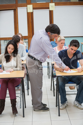 Lecturer helping student