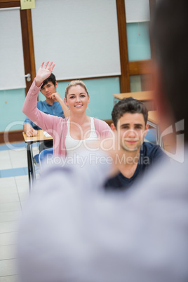 Woman asking question in class