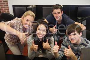 Students giving thumbs up