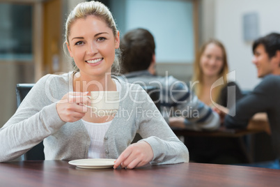 Woman holding cup of coffee