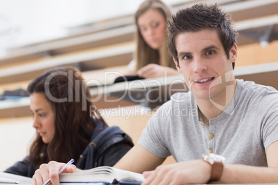 Student looking up from lecture and smiling