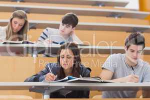 Students sitting at desks in lecture hall