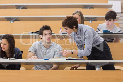 Teacher helping student
