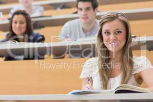 Students sitting at the lecture hall smiling