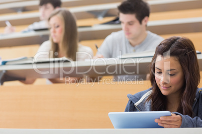 Student using tablet pc to take notes
