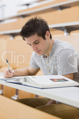 Man sitting writing