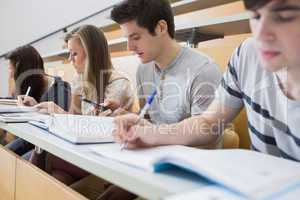 Students sitting at the desk at the lecture hall