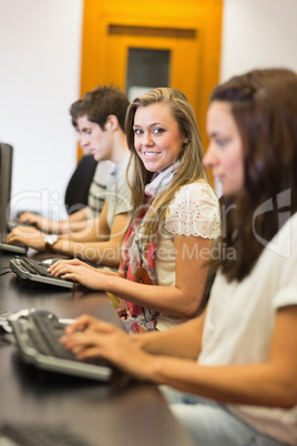 People sitting at the computer smiling