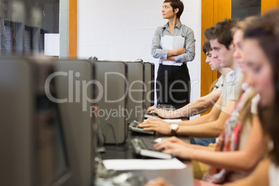 Students sitting at the computer room concentrating