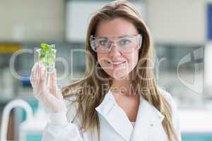Student standing at the laboratory smiling