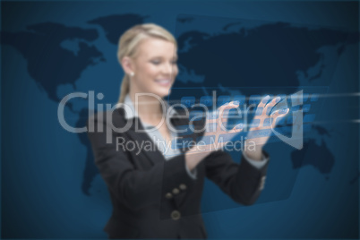 Businesswoman standing while typing on digital keyboard