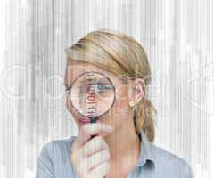Woman standing holding a magnifying glass