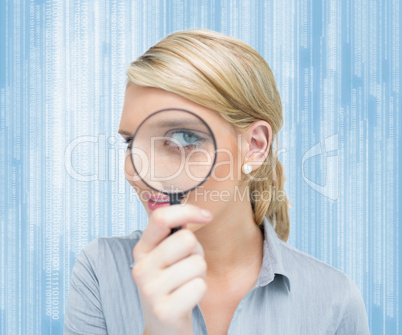 Woman looking through magnifying glass