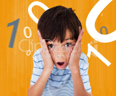 Boy looking scared against orange background