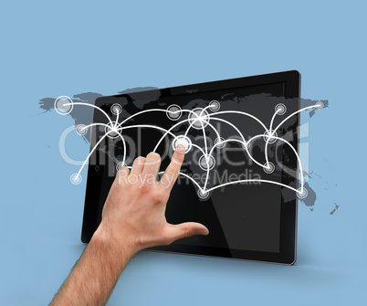 Finger selecting world map on tablet pc