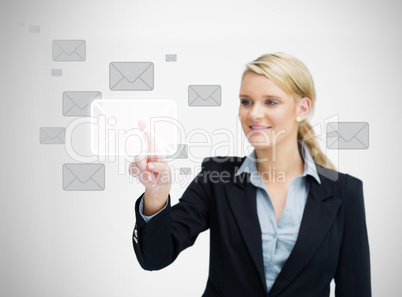 Businesswoman touching email symbol