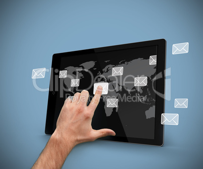 Hand selecting email symbol on tablet pc