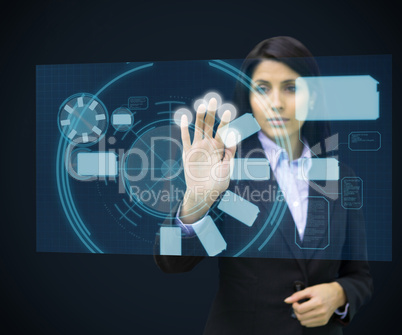 Concentrate woman standing while touching interface