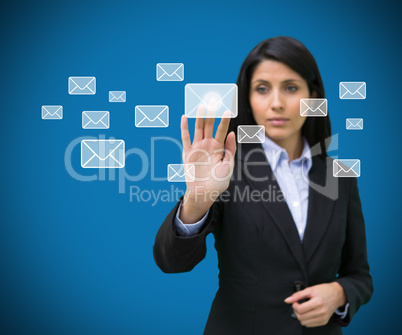 Concentrate businesswoman touching at a message symbol