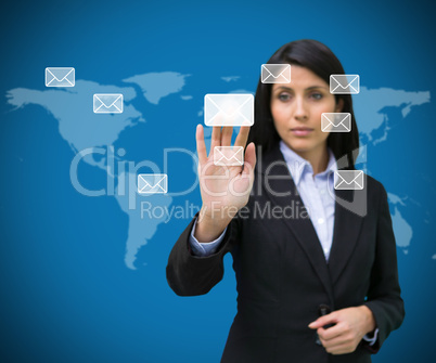 Businesswoman selecting email symbol from many