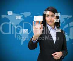 Businesswoman selecting email symbol from many