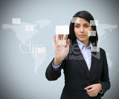 Businesswoman pushing email symbol