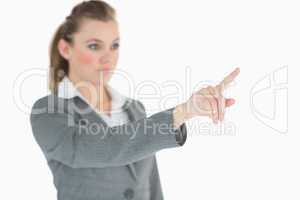 Blonde businesswoman raising her finger