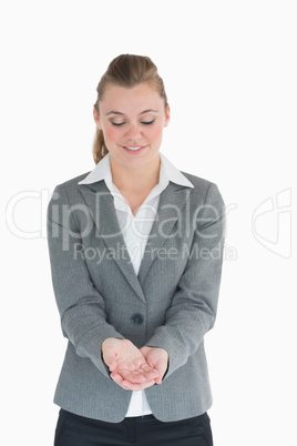 Blonde woman looking at her hands