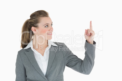 Businesswoman pointing up Businesswoman pointing up