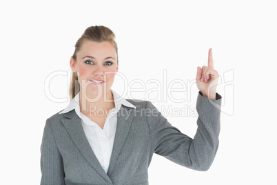 Businesswoman is pointing up