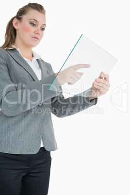Businesswoman pointing at something on the pane