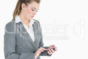 Businesswoman touching on smartphone