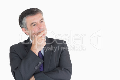 Businessman looking thoughtful