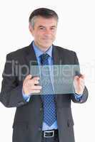 Cheerful man holding a pane