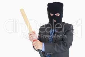 Smiling businessman dressing like a burglar