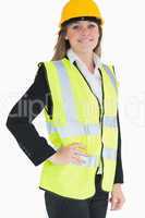 Smiling woman wearing vest and helmet