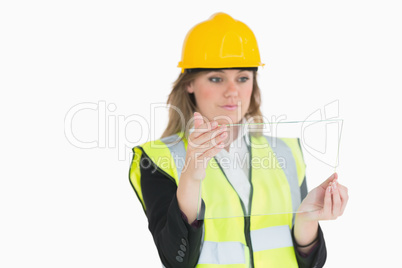 Female architect holding a pane