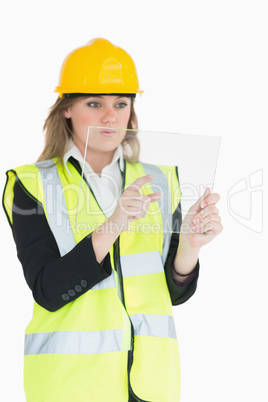 Female architect pressing something on a pane