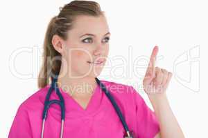 Smiling doctor pointing at something