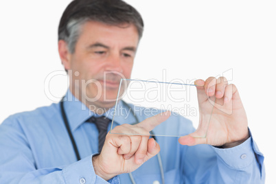 Doctor touching on clear pane