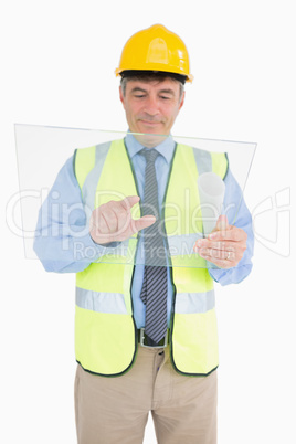 Man in vest and with helmet holding pane