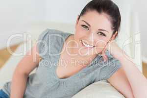 Smiling woman sitting on the couch