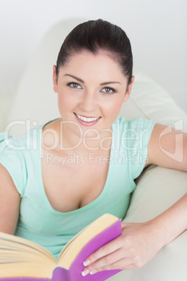 Woman sitting on the couch and reading